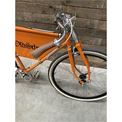 Fully restored vintage advertising bicycle with 2 stroke petrol engine, orange frame, tan leather seat