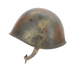 Italian RSI/10th M.A.S. Flotilla (Decima Flottiglia MAS). M33 Camouflage helmet- re-issued to the G.N.R. Circa.1944/45
extremely rare Italian M33 steel helmet in camouflage paintwork which belongd to the famous 'Decima Flottiglia MAS' the Italian Elite Naval Commandos. The helmet retains the Italian tri-colour to oneside, the yellow anchor to the front and the red X to the other side. the helmet is complete with its correct liner and chinstrap. When it was re-isseued it was painted in camouflage with the new insignia to the front of the G.N.R. 'Guardia Nazionale Republican' and this camouflage was only used to the latter part of WWII by R.S.I (Repubblica Sociale Italiana)   