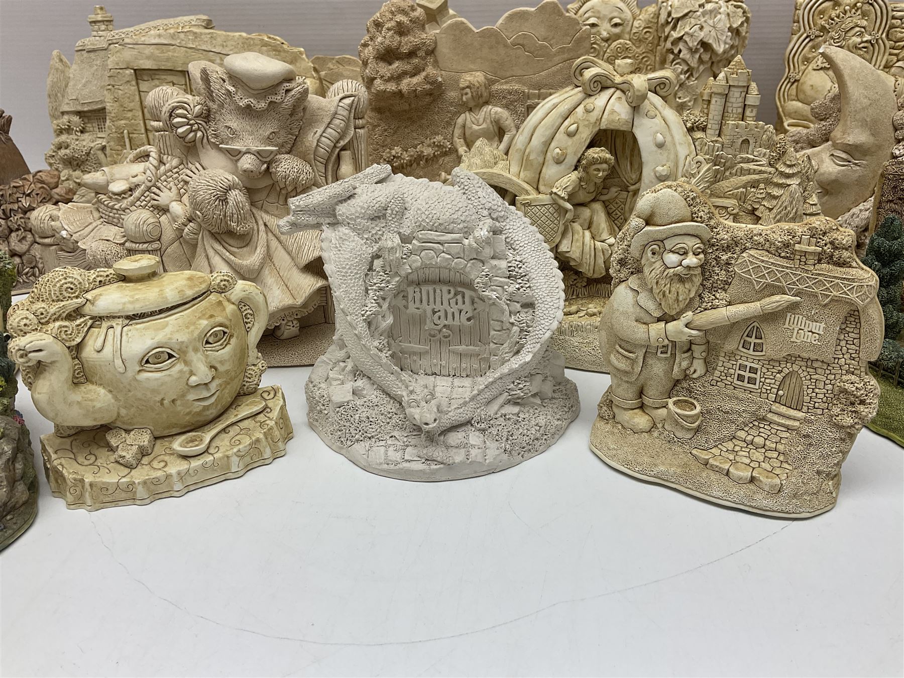 Thirty three Lilliput Lane models from the British collection and paint your own Children's Plaques, to include I am a little teapot, Gnome improvements, Dennis the Dragon, Bill and Ben, The Bobbins etc, some with boxes and deeds 