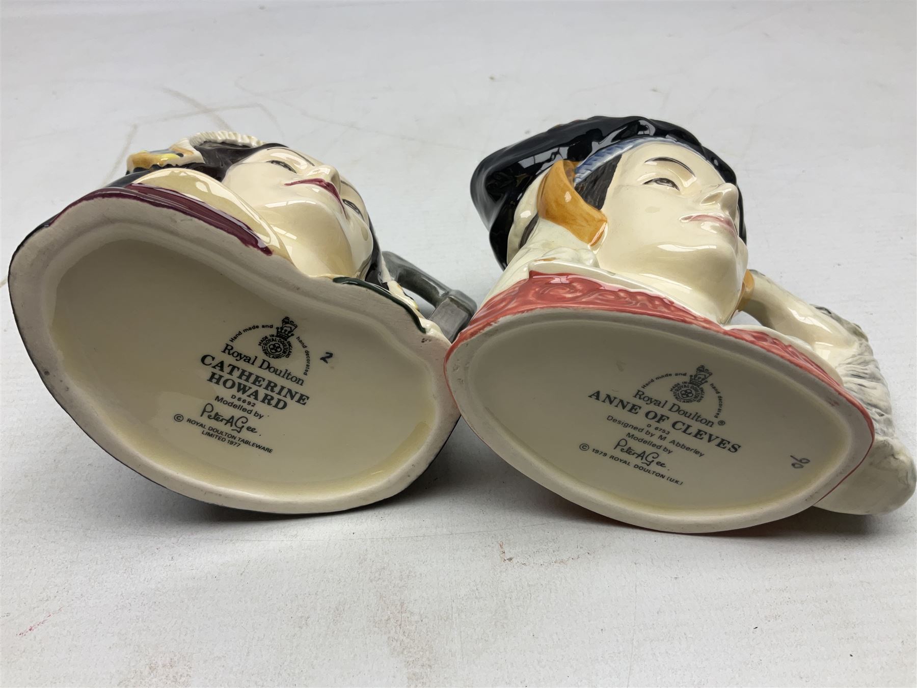 Royal Doulton Henry VIII and his Six Wives Character Jugs, comprising of Henry VIII D6647, Catherine of Aragon D6657, Anne Boleyn D6650, Jane Seymour D6746, Anne of Cleves D6753, Catherine Howard D6692 and Catherine Parr D6751, tallest H10cm