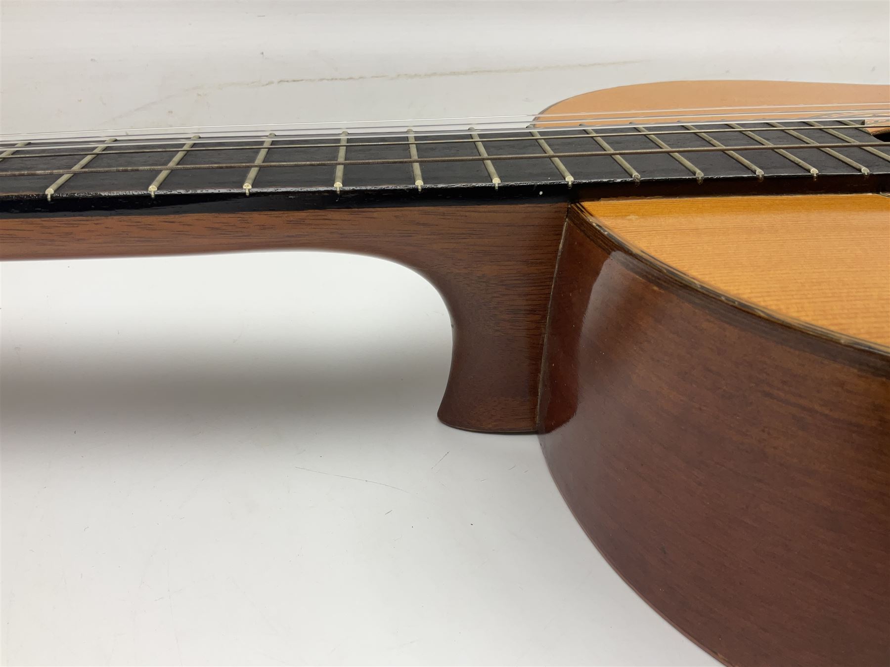 Spanish BM acoustic guitar with mahogany back and sides and spruce top L101cm; in cello carrying case; Roland foot pedal and two Yamaha foot pedals; tin D# organ pipe; folding music stand etc