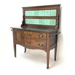 Late Victorian walnut wash stand, raised shaped tiled back, two drawers flanking single cupboard, shaped apron, square tapering supports 