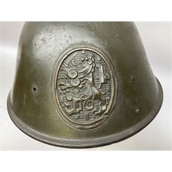 WW2 French M-26 Adrian Pattern Steel Helmet, original olive drab paint finish; flaming grenade badge to the front signifying issue to an Infantry regiment; original leather liner and leather chinstrap; and WW2 Dutch steel helmet with liner and chin strap (2)
