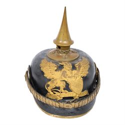 WWI Prussian Pickelhaube, Baden Infantry Regiment, the black leather skull with detachable brass spike, the circular base plate set with four star retaining studs, brass eagle helmet plate, both sides with red and black cockades