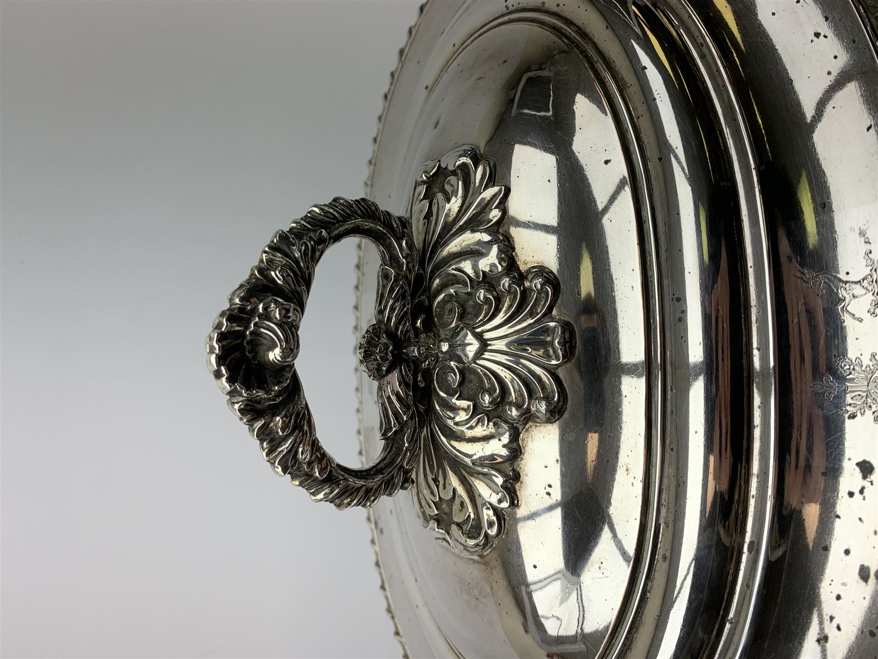 Matthew Boulton silver plated tureen and cover, the body of oval form with twin handles engraved with crest, probably for Whitgreave/Whitgrave family of Moseley Staffordshire, 'Regem Defendere Victum', (To defend the king even in his defeat/To defend the conquered king ), upon four paw feet, the cover with gadrooned rim and foliate loop handle 