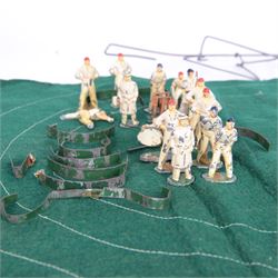 1940s Tulltoy by Phillip Segal Toys 'Real Cricket in Miniature' circa 1947, includes thirteen lead cricketers, six with red hats and seven with blue, two umpires, two sets of wickets, one metal ball, felt cricket pitch with white stitching and metal batting and bowling fixtures, contained within original box