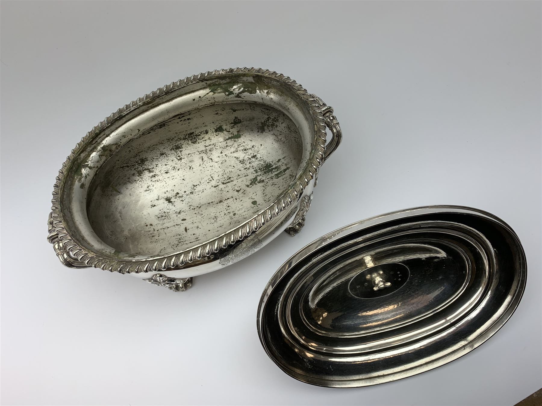Matthew Boulton silver plated tureen and cover, the body of oval form with twin handles engraved with crest, probably for Whitgreave/Whitgrave family of Moseley Staffordshire, 'Regem Defendere Victum', (To defend the king even in his defeat/To defend the conquered king ), upon four paw feet, the cover with gadrooned rim and foliate loop handle 