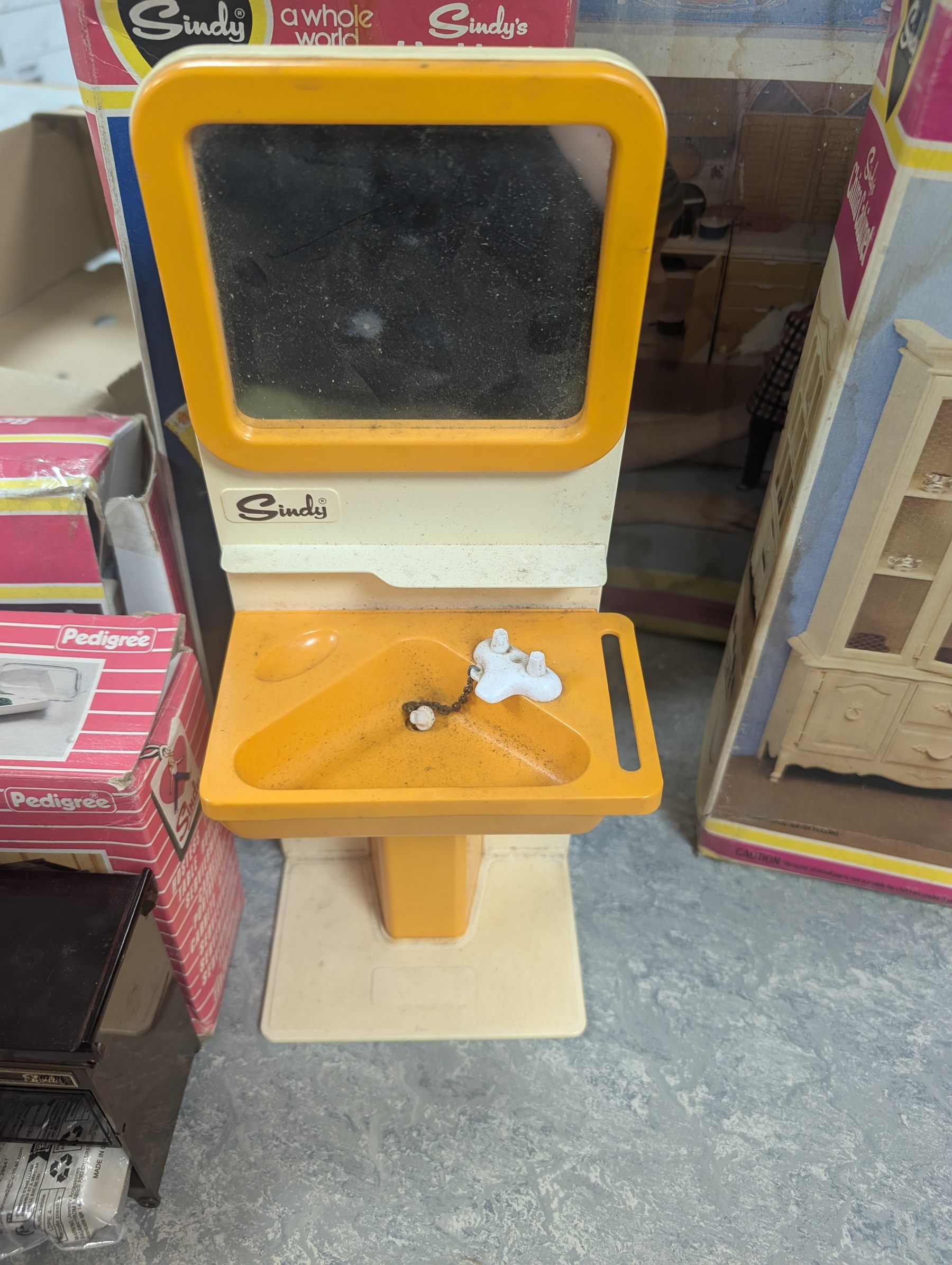 Pedigree Sindy's House and furniture, including shower, kitchen unit, washbasin, china cabinet and bed, all boxed, together with Barbie doll and horse