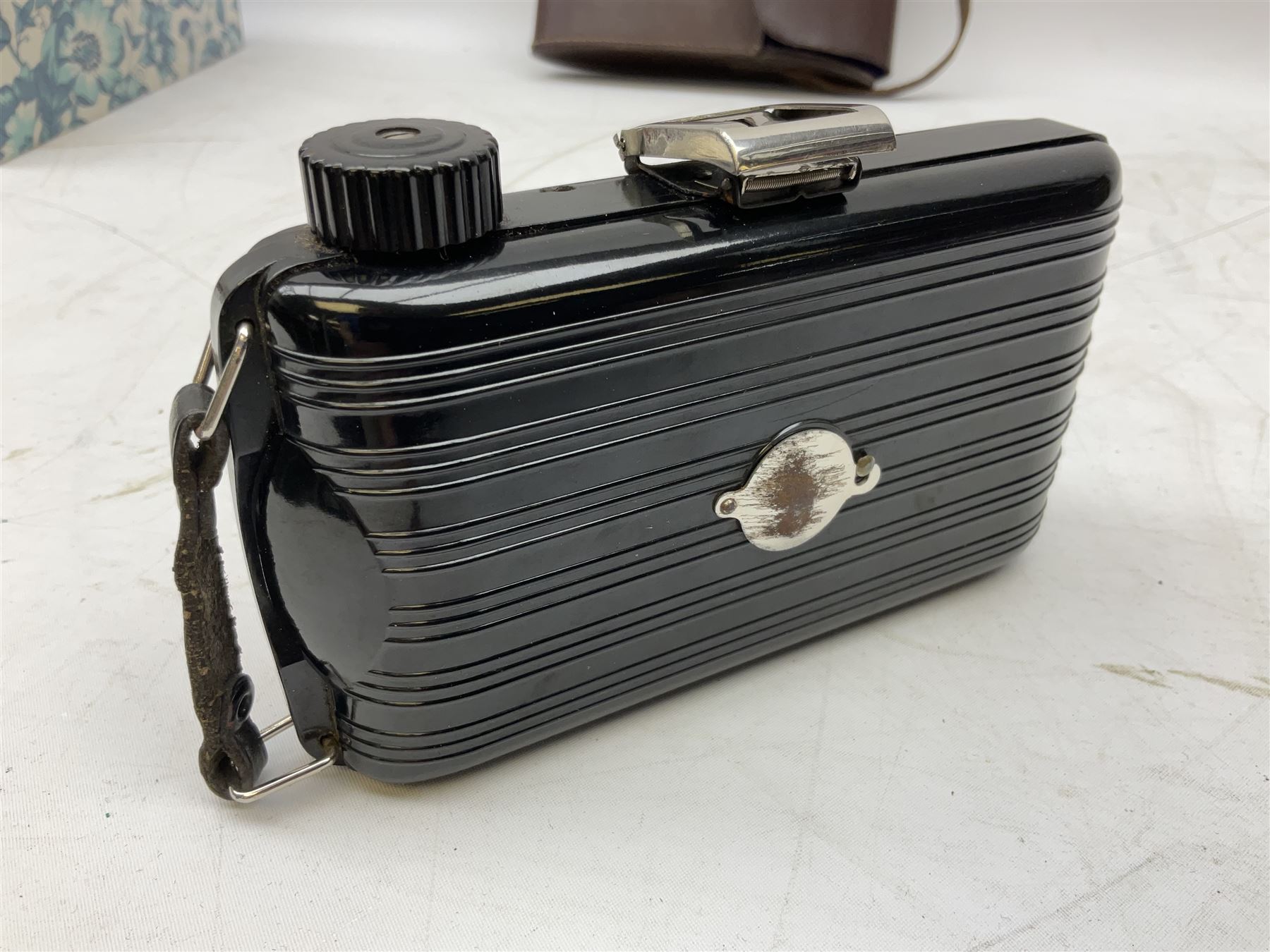 Bilora Boy Box Camera, with leather case, together with Zeiss Ikonta folding camera and another similar example 