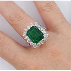 18ct white gold octagonal cut emerald and round brilliant cut diamond cluster ring, with diamond set shoulders, emerald 4.64 carat, total diamond weight 1.80 carat, with World Gemological Institute report