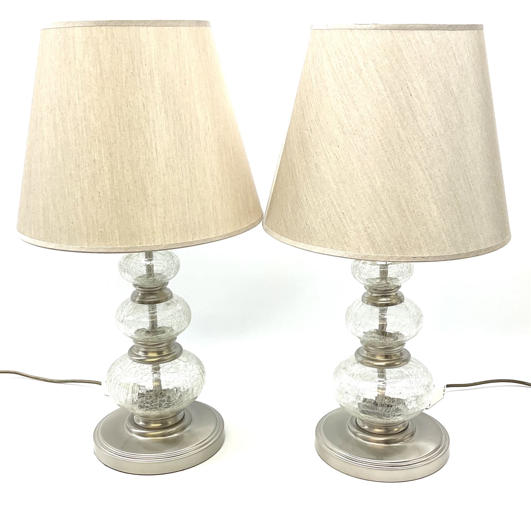 A pair of crackle glass table lamps each of three spheres, on circular