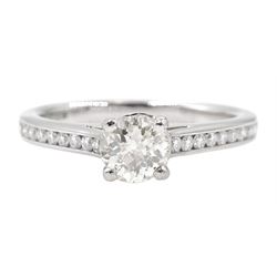 Platinum single stone diamond ring, with channel set diamond shoulders, hallmarked, central diamond approx 0.50 carat