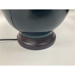 Pair of Chinese teal glazed table lamps, each of bottle form, raised upon circular hardwood bases, including shade H72cm 