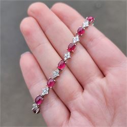 18ct white gold ruby and diamond bracelet, fifteen oval cabochon cut rubies, each spaced by four round brilliant cut diamonds, Sheffield 2009, total ruby weight 10.10 carat, total diamond weight approx 0.60 carat