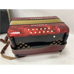 German Hohner student II compact accordion with 26 keys and 12 bass registers in a hard case With tutor