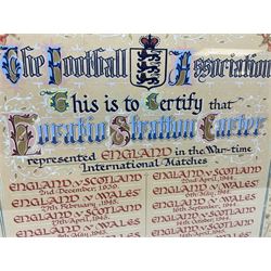 Football Association illuminated manuscript certificate awarded to Horatio Stratton Carter (Raich Carter) dated April 1946 in recognition of his representing England in the War Time International matches, listing fourteen appearances out of the twenty-nine unofficial matches played during the War against Scotland, Wales and France from December 1939 to May 1945, to which is added three post-war Victory International games against Ireland, Switzerland and France May - September 1946. 35 x 27cm, card mounted in a gilt frame. Auctioneers Note: War Time Internationals were not rewarded with Caps but when the War finished certificates were issued by the Football Association and this is the original scroll presented to Raich Carter. Provenance: By direct descent from the family of Raich Carter having been consigned by his daughter Jane Carter.