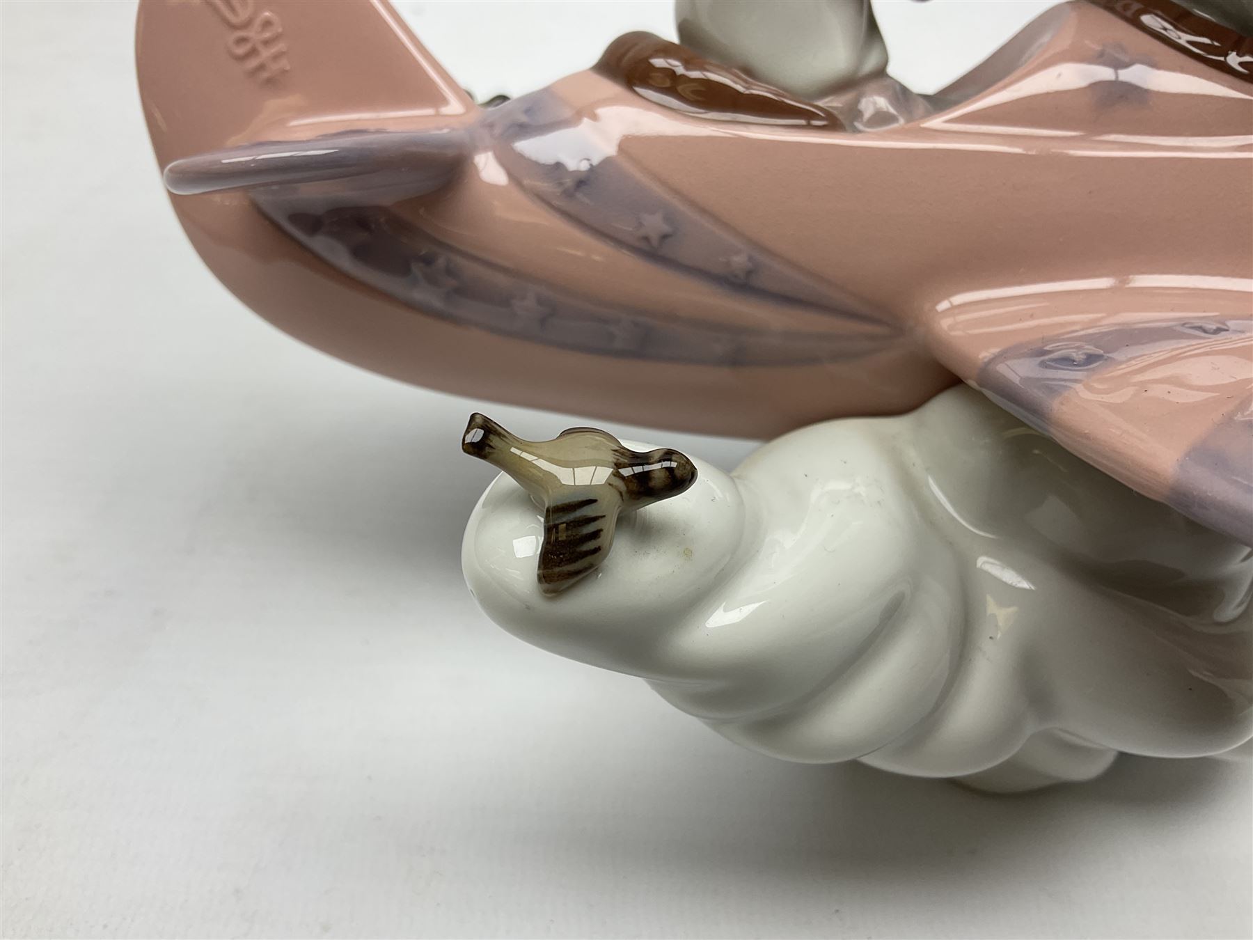 Lladro figure, Don't Look Down, modelled as a girl and boy in a plane, sculpted by Joan Coderch, no 5698, year issued 1990, year retired 2004, H17cm