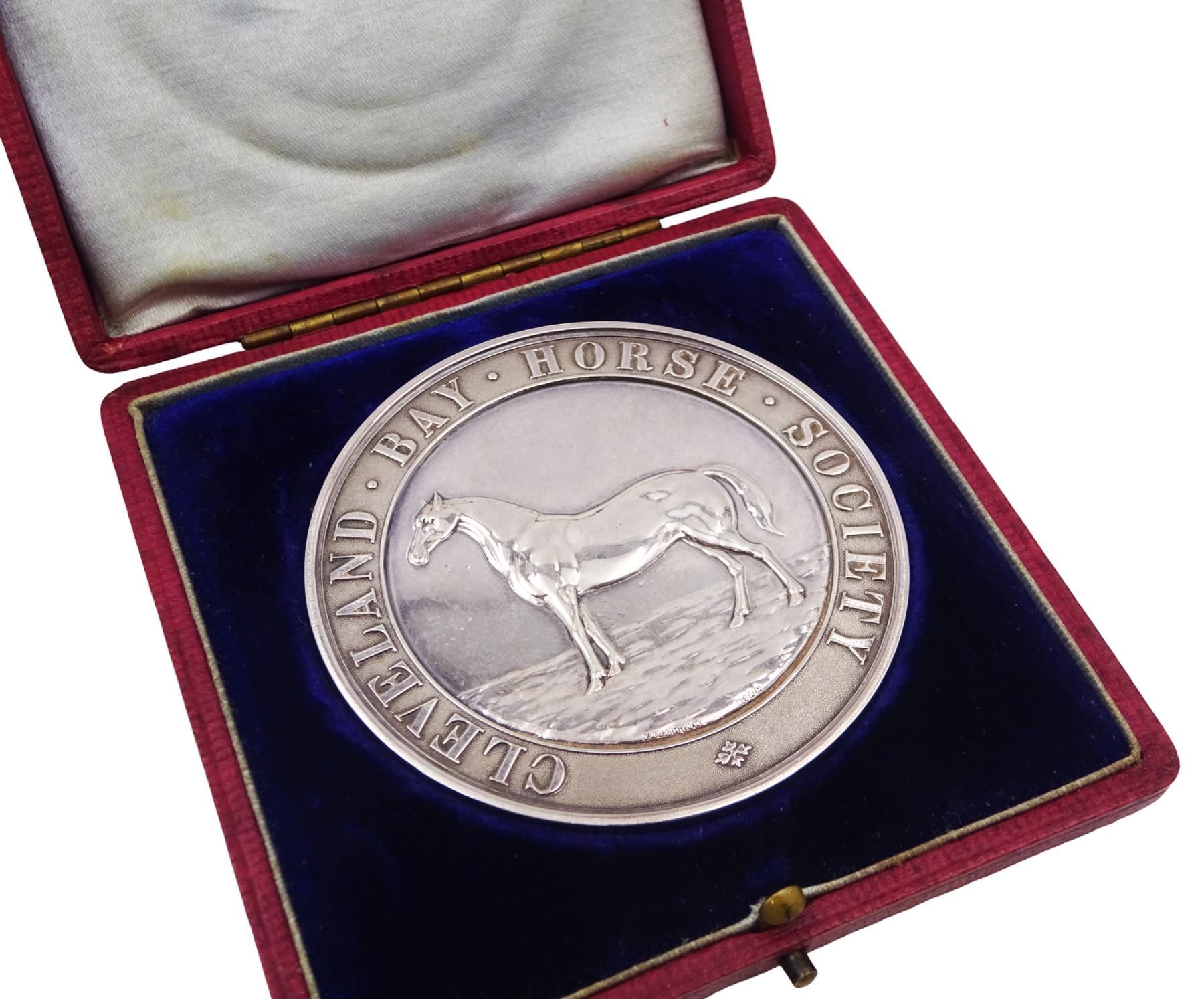 Edwardian silver medal, of circular form, embossed to front with a bay horse and inscribed Cleveland Bay Horse Society, engraved verso 1904 Egton Show won by Rock Dove No 1000 bred at Rock Head by W Duell, hallmarked Vaughton & Sons, Birmingham 1903, contained within fitted case, D6.3cm
