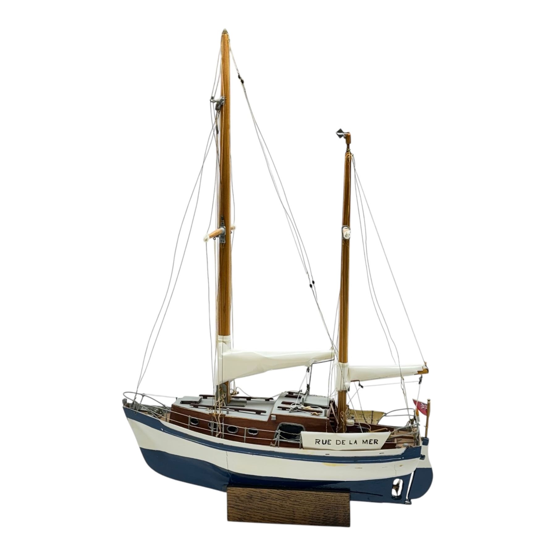 Scratch built model yacht 'Rue de la mer', with painted blue and white hull, with acrylic case, model H67.5cm