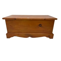 Solid pine blanket  box, hinged top, on shaped and moulded plinth base