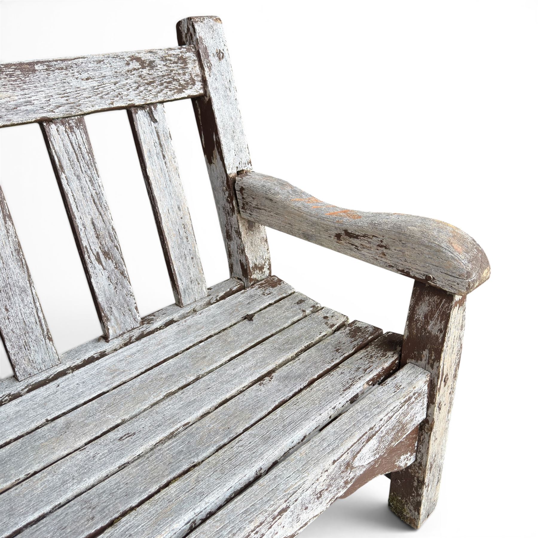 Teak garden bench with slatted back and seat on square supports in weathered which finish 