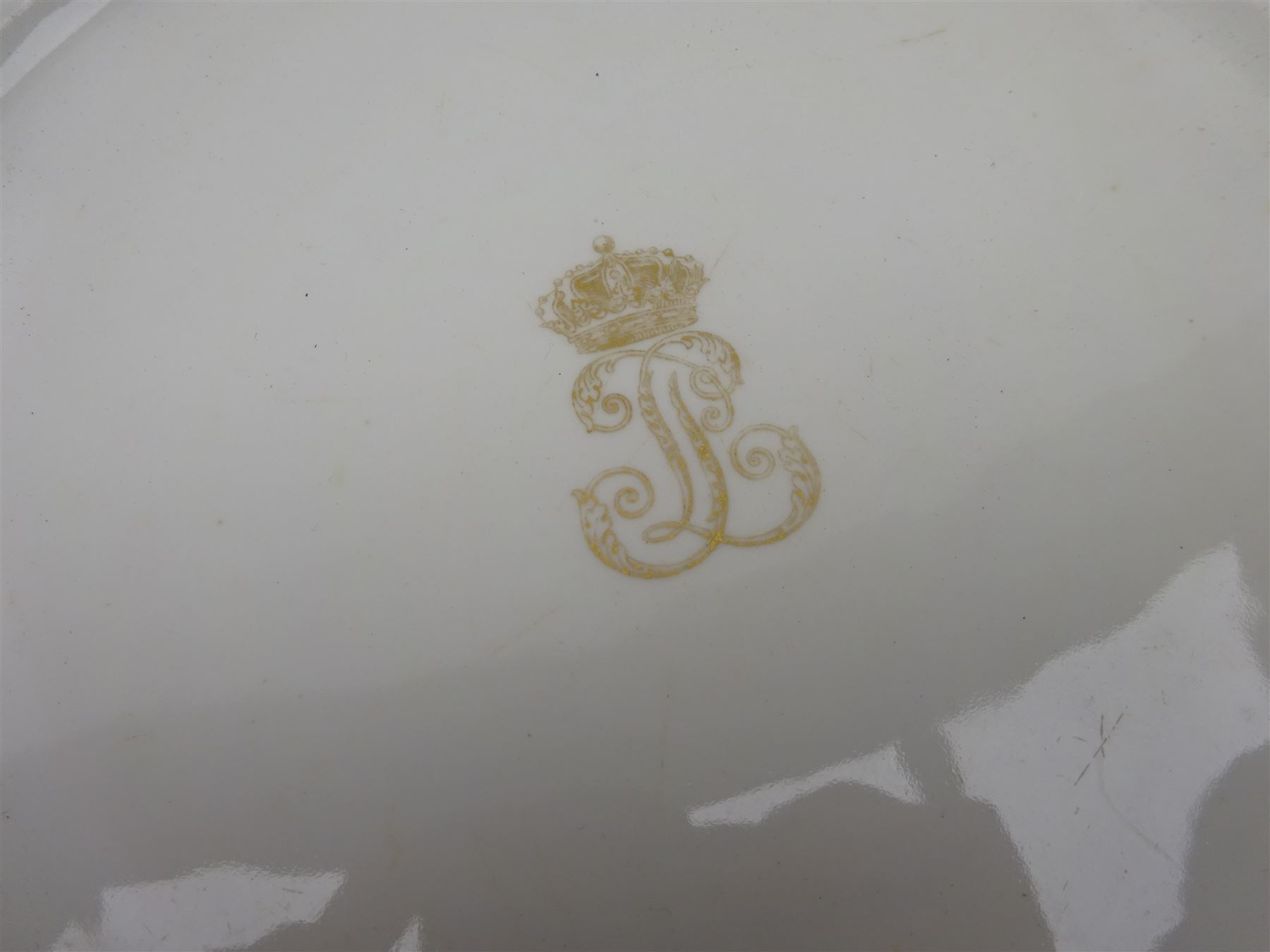 Pair mid 19th century Sevres porcelain plates, with gilt Louis Phillippe crowned monogram to centre upon a white glazed ground, with blue crowned LP mark, iron red destination mark for Chateau D'Eu, and chrome green cancelled potting mark S67 beneath, in carved oak mounts, overall D34cm
     