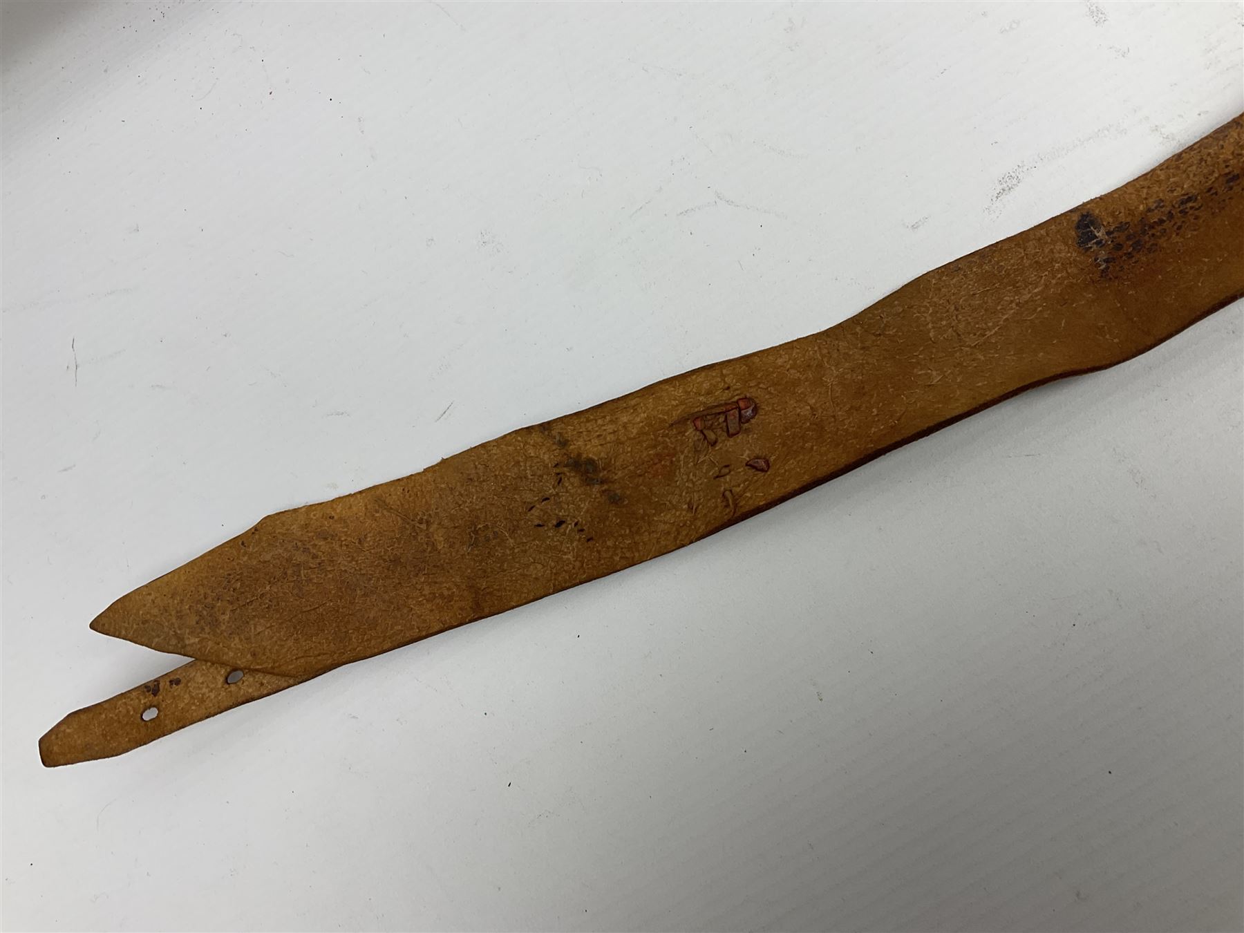 Saudi Arabian khanjar dagger with 29.5cm curving double edged  steel blade; white metal and copper mounted horn grip; in white metal mounted brass and leather scabbard incorporating embroidered leather wearing strap