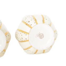 Pair of Grainger & Co. Royal China Works Worcester vases, of globular form with knopped elongated neck, with alternating reticulated panels  and gilt highlights, with printed mark beneath each numbered 1963, H19cm