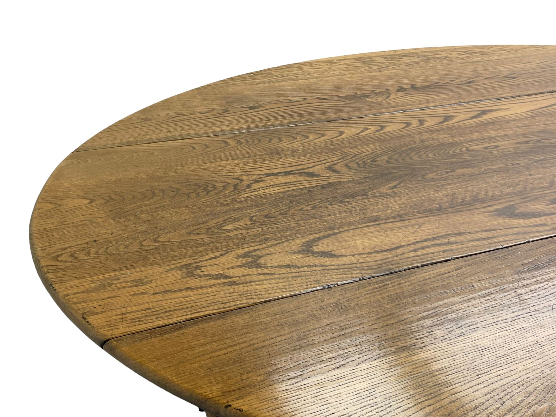 Large 18th century design oak wake or dining table, oval drop-leaf top, turned supports with double gate-leg action base, united by moulded stretchers 