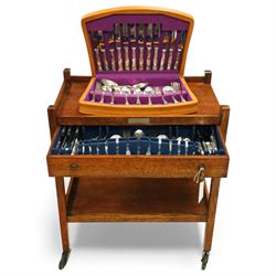 Suite of Kings Pattern plated cutlery for eight covers, in an oak cutlery trolley, and ano...
