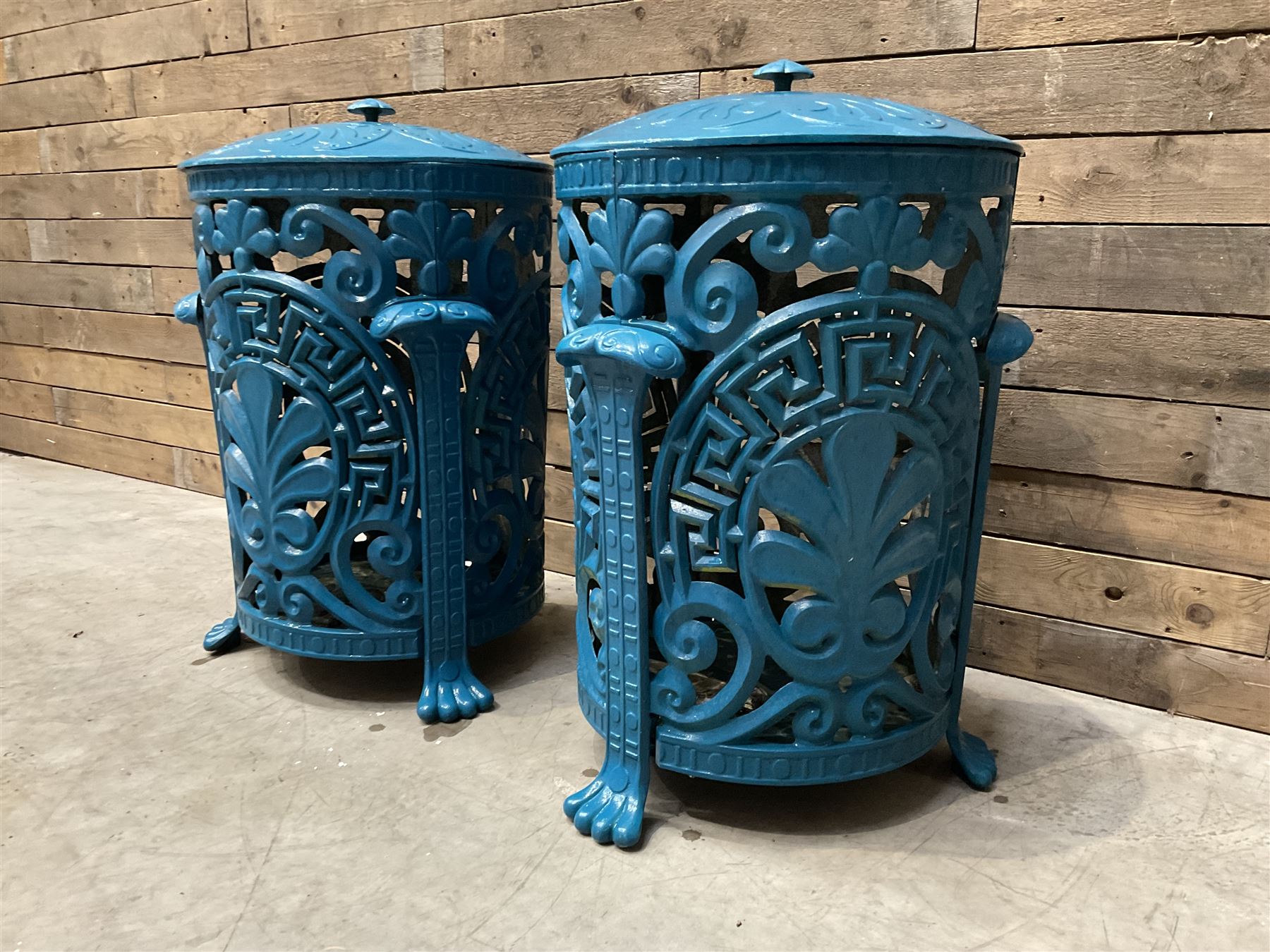 Pair of blue painted cast iron garden bins