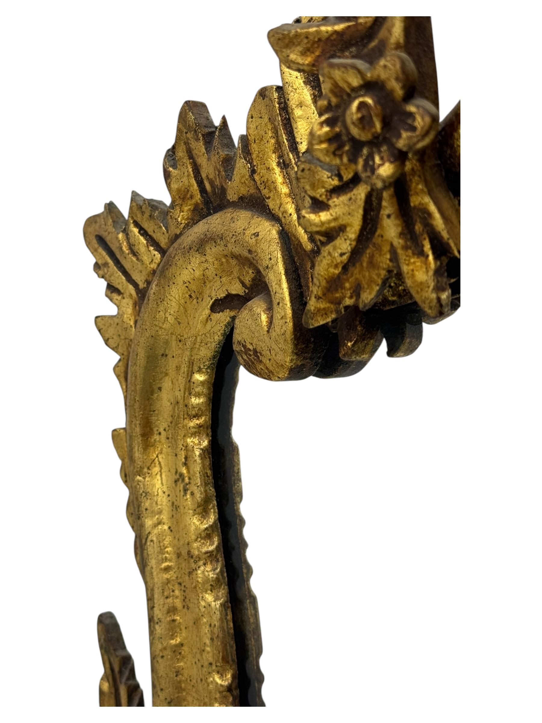 18th century design gilt framed wall mirror, within a pierced and scrolling foliate frame, leaf sprays and flowerhead cresting