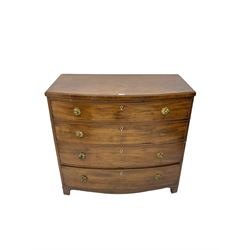 Regency mahogany bow front chest, the top with ebony and satinwood stringing, fitted with four cockbeaded drawers with brass pull handles and bone escutcheons, on bracket feet