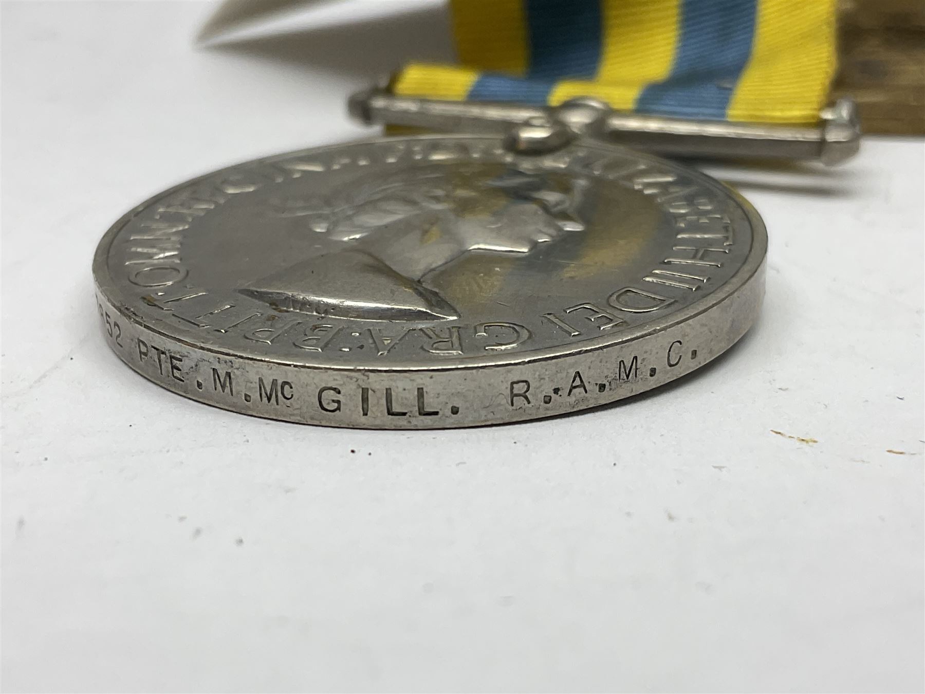 Korean War group of three medals comprising ERII Korea Medal awarded to 22307852 Pte. M. McGill R.A.M.C., UN Korea Medal and ERII General Service Medal with Malaya clasp to 22307852 Cpl. M. McGill R.A.M.C.