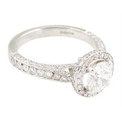 Platinum round brilliant cut diamond cluster ring, the principal diamond of approx 1.05 carat, with diamond surround and shoulders, London 2009, total diamond weight approx 1.65 carat