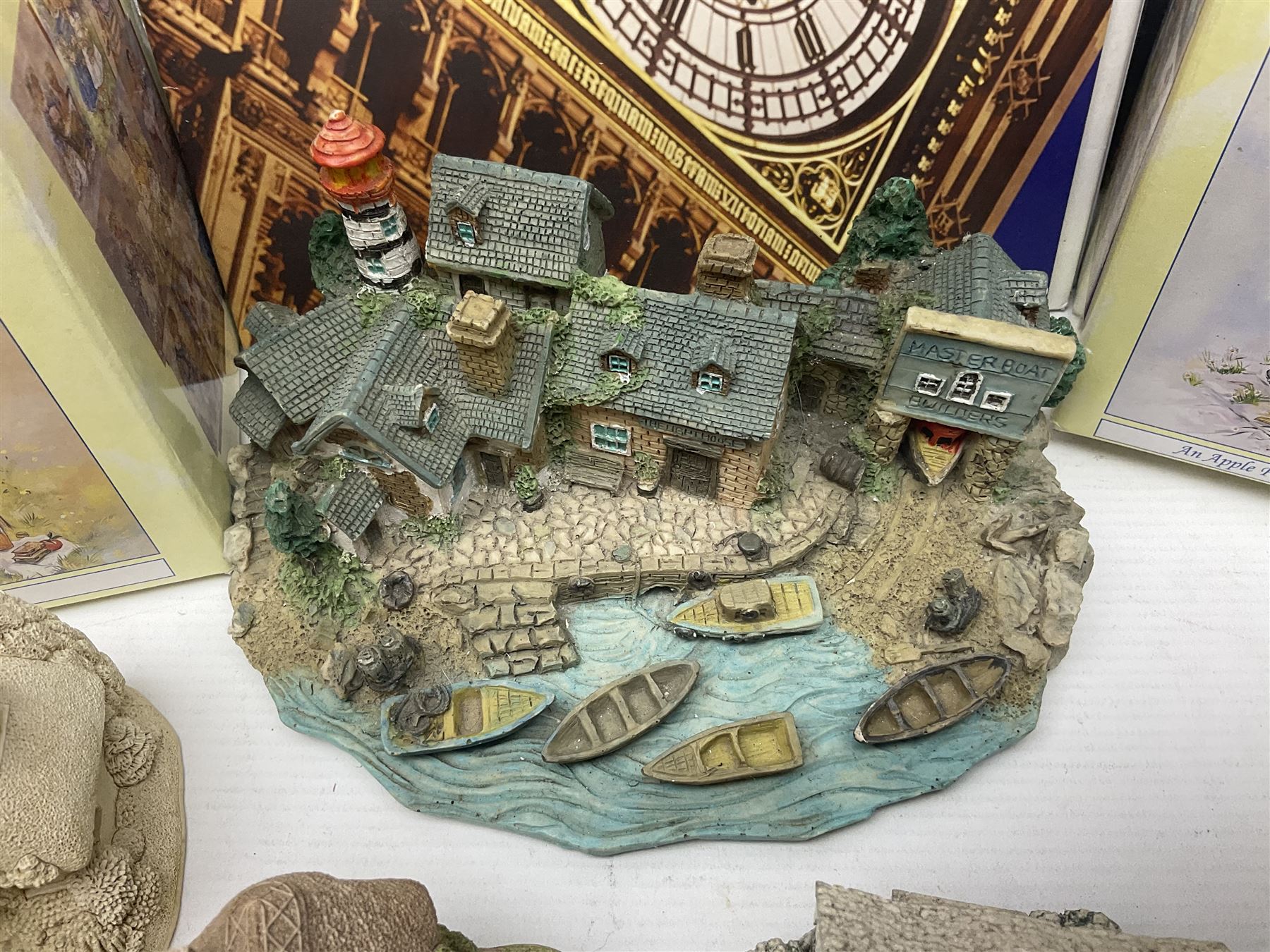 Twenty three Lilliput Lanes, including Village School, Lace's Shoe Shop, Cockles & Muscles, Scotland the Brave etc, together with The Leonardo Collection Paint Box Poppets and Gullivers World magazines 