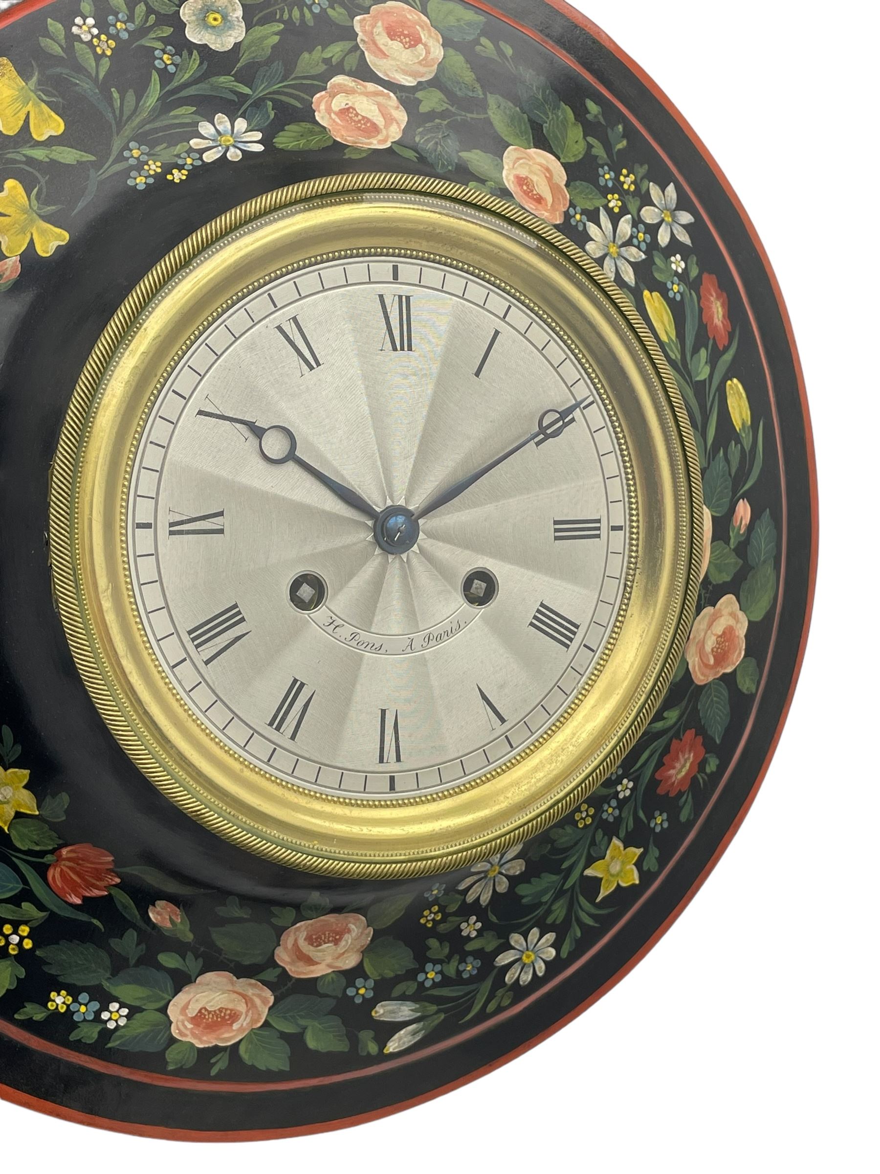 Honore Pons of Paris -  A good and early 19th century Tole Ware wall clock c1830, with a later re-decorated case suspended from a circular brass hanger, cast brass dial bezel and silvered engine turned dial with roman numerals, minute track and steel moon hands, 8-day twin train countwheel striking movement with a silk suspension, striking the hours and half hours on a bell. With pendulum and key.
