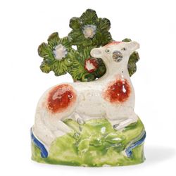 Early 19th century Staffordshire pearlware group by Ralph Salt, modelled as a sheep and lamb before a flowering bocage, impressed 'Salt' verso, H16cm, pair of similar Staffordshire pearlware sheep and ram and poodle group, numbered 198 beneath, with 'Max Bilbe Collection' label (4)