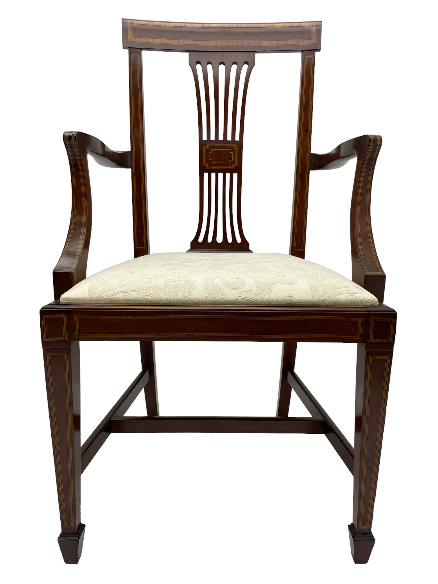 Set twelve (4+8) Edwardian inlaid mahogany dining chairs, cresting rail with satinwood banding, pierced splat backs with central inlay, drop-in seats upholstered in foliate patterned ivory fabric, raised on square tapering supports terminating in spade feet
