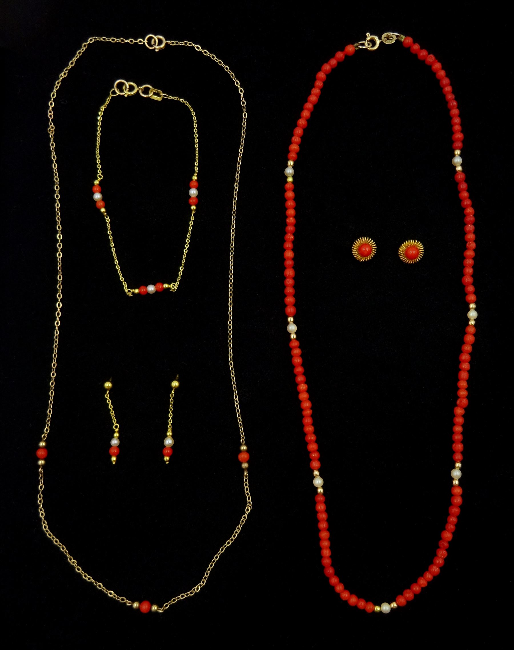 Pair of 18ct gold coral screw back stud earrings, two gold coral and pearl necklaces, similar bracelet and stud earrings, all 9ct