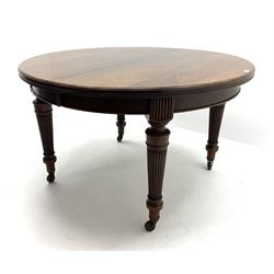 Victorian mahogany telescopic extending dining table, circular moulded top with three additional leaves, on turned and reeded supports terminated at brass and ceramic castors, D122cm, L245cm (fully extended), H73cm