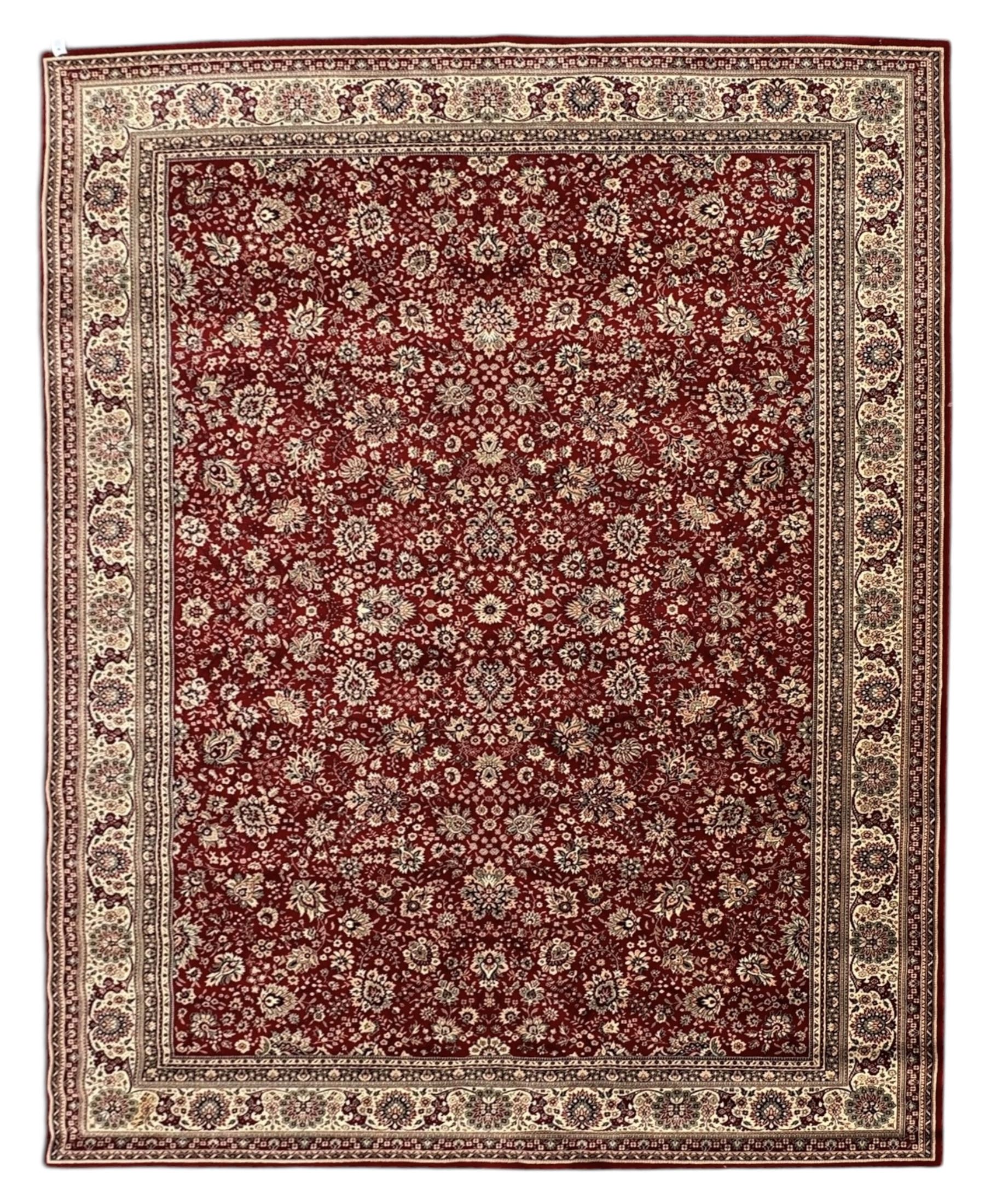 Royal Kashmir worsted wool modern Persian design area rug, with crimson field and stylised rosette patterning throughout, surrounded by wide multi-band border incorporating cartouche and lotus flower motifs