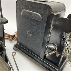 Early 20th century tinplate combined magic lantern and 35mm cinematograph projector, hand-cranked, with electric bayonet lamp, fitted with film reels, L35cm overall, and a similar projector by Gebruder Bing Nuremberg with spirit lamp (glass chimney a/f) L22cm, with two reels of film 