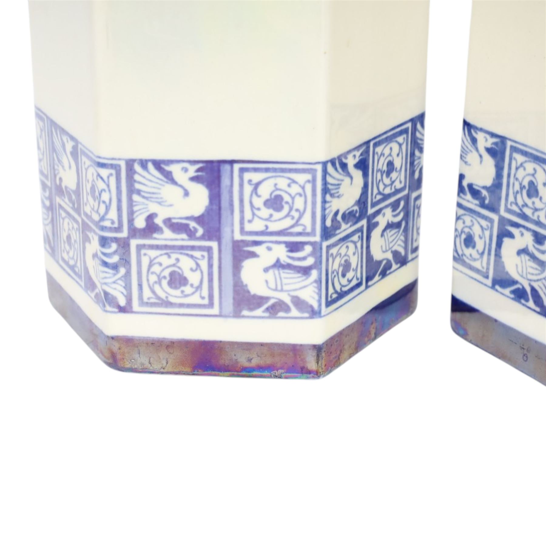 Pair of 1920's Art Deco Royal Doulton lustreware hexagonal vases, with boards of checkerboard design of alternating bird and scroll motifs, designed by Reco Capey, H28cm