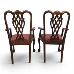 Chippendale design set of ten (8+2) mahogany dining chairs, serpentine cresting rails with carved detail over pierced ribbon-tied splats, red damask upholstered drop-in seats, on cabriole supports with acanthus carved knees and claw and ball feet