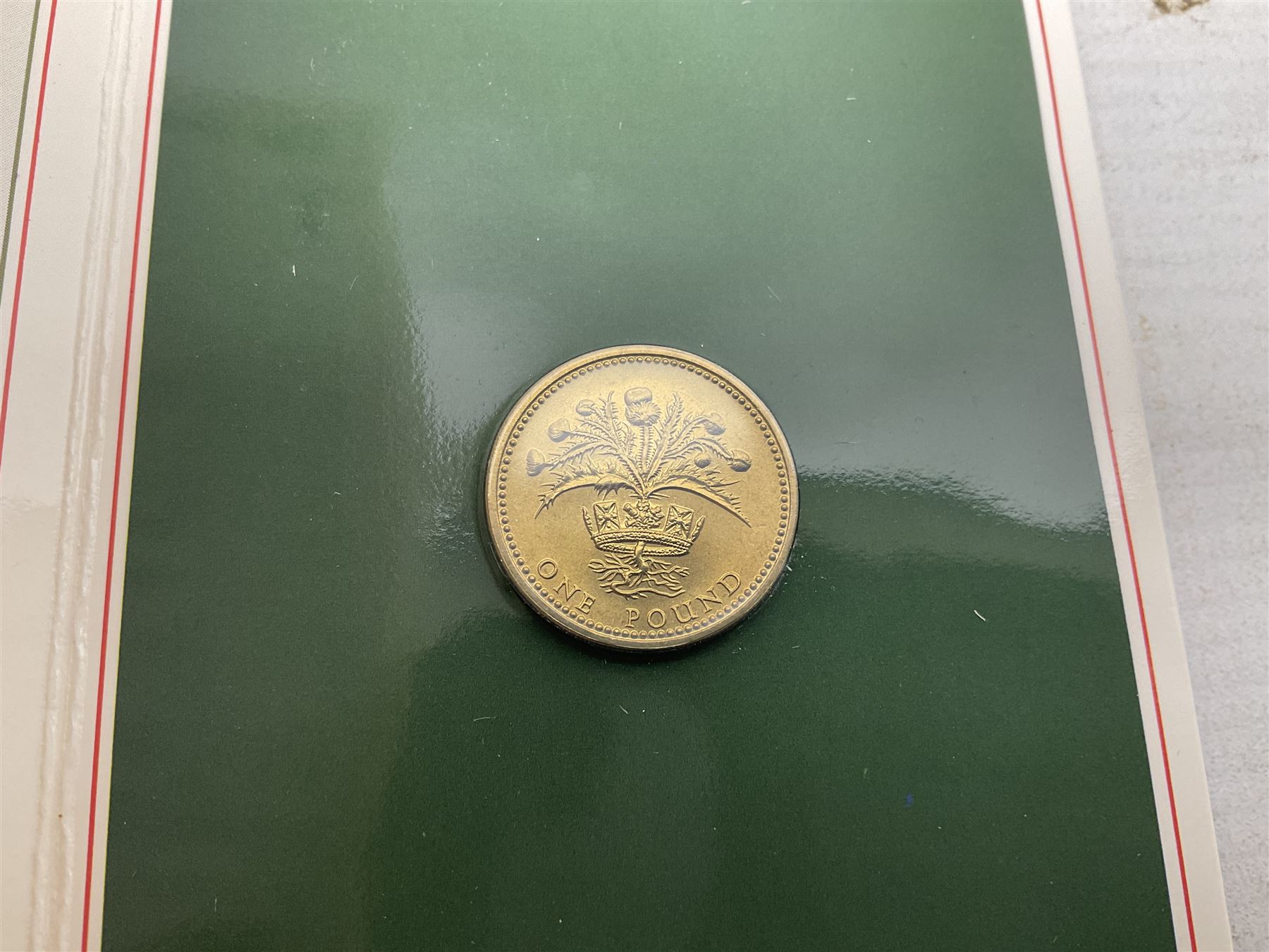 Two Great Britain and Northern Island proof sets dated 1970 and 1971, both with card cases, three 1986 Commonwealth Games commemorative two pound coins, in card folders, and six brilliant uncirculated one pound coins, in card folders