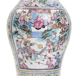 Large pair of 19th century Cantonese famille rose vases, each painted with various courtly scenes, including a display of warriors fighting on horseback before an official and his attendants, double Buddhist lion handles and applied at the shoulders with chilong, the lower band painted with Greek key motif, H58cm (2)