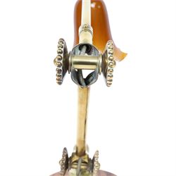 John Dugdill, early 20th century brass angle poise desk lamp, circa 1930's, with daisyhead joints and amber coloured lampshade, upon a circular wooden base 
