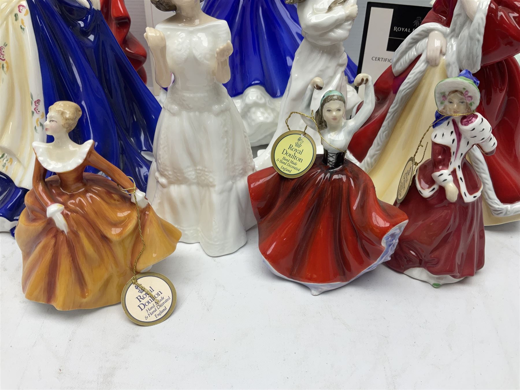 Seven Royal Doulton figures, comprising Sara HN2265, Lorraine HN4301, Mary HN3375, Olivia HN5114, Charlotte HN4092, Josephine HN4223 and Rachel HN4780, together with five smaller Royal Doulton figures (12)