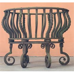 Wrought iron dog grate of oval outline, raised on six scrolled supports. H42cm, W52cm, D41cm.  - COLLECTION BY APPOINTMENT FROM: The White House, Thirsk Road, Easingwold, York, YO61 3NF - CALL 01723 507111 TO ARRANGE